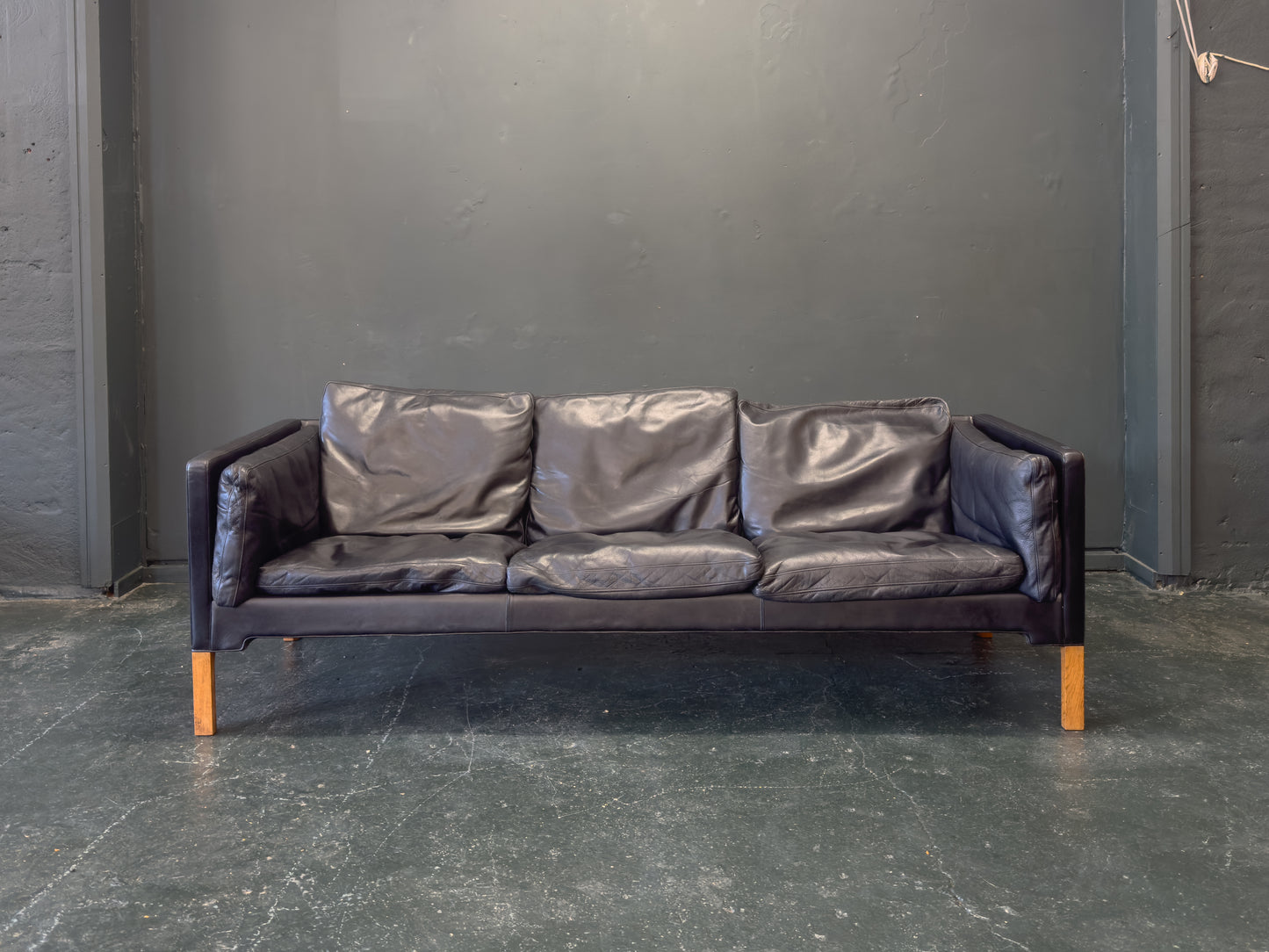 Black Leather Three-Seater Sofa