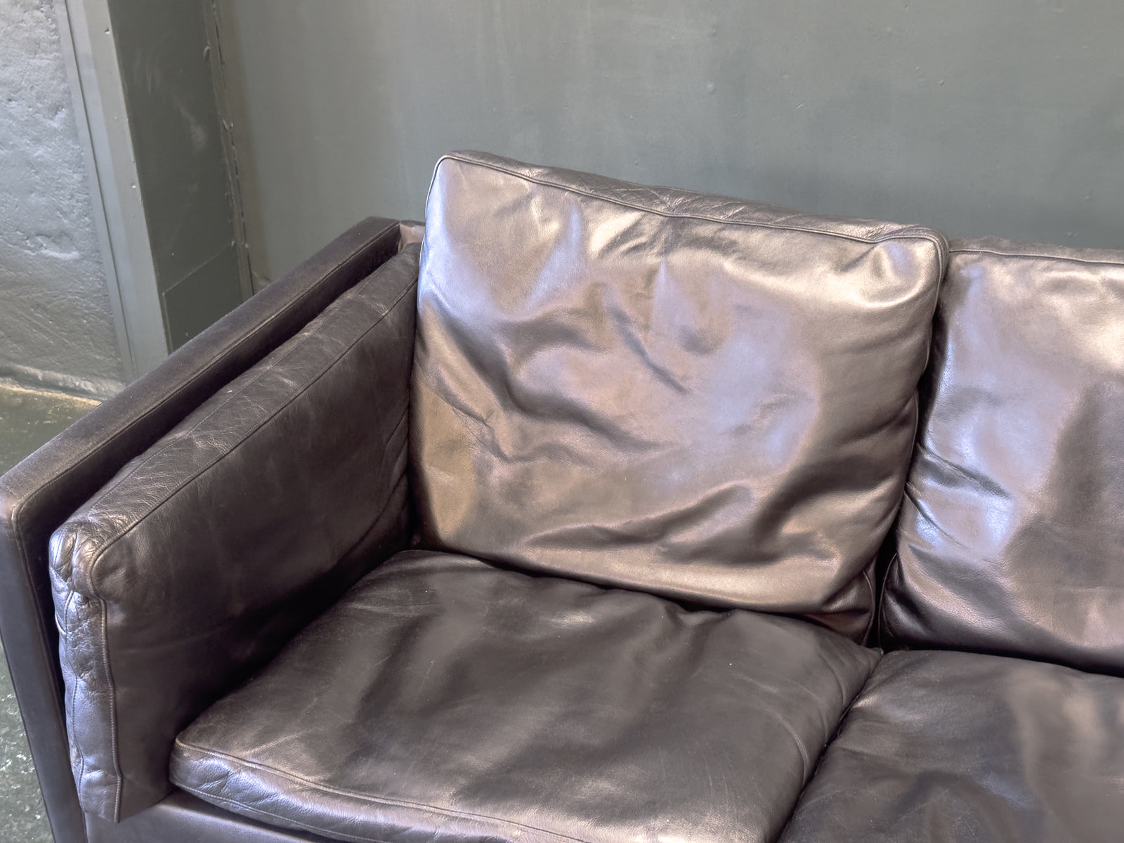 Black Leather Three-Seater Sofa