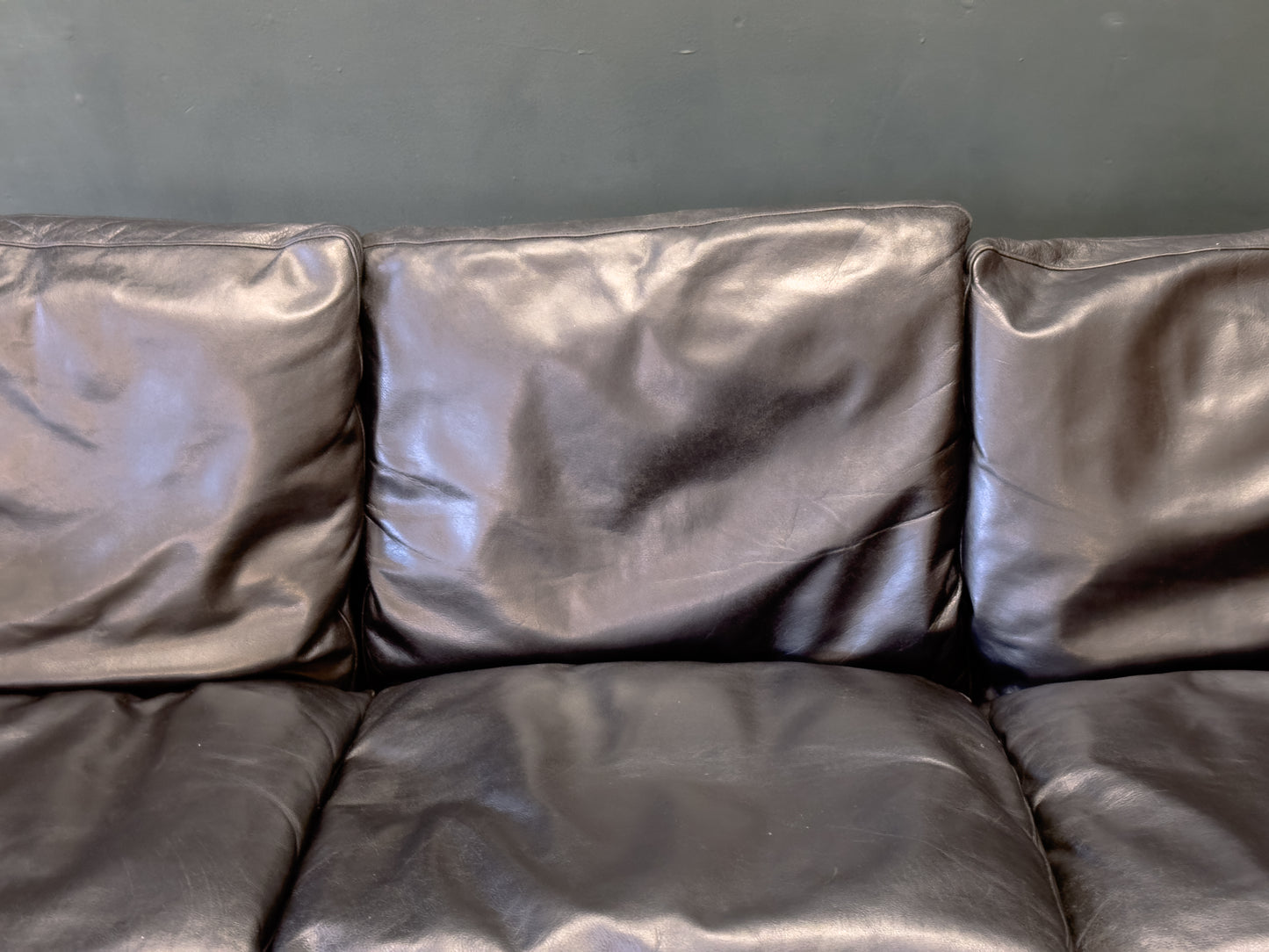Black Leather Three-Seater Sofa