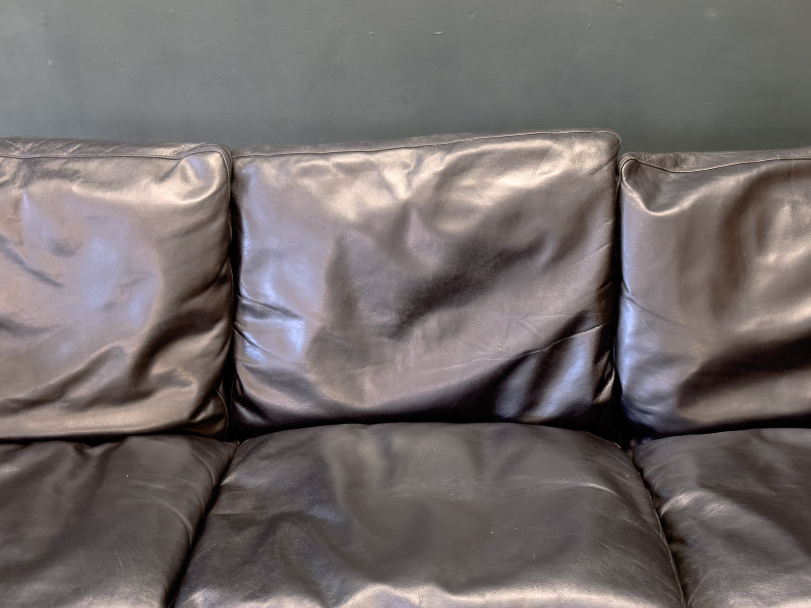 Black Leather Three-Seater Sofa