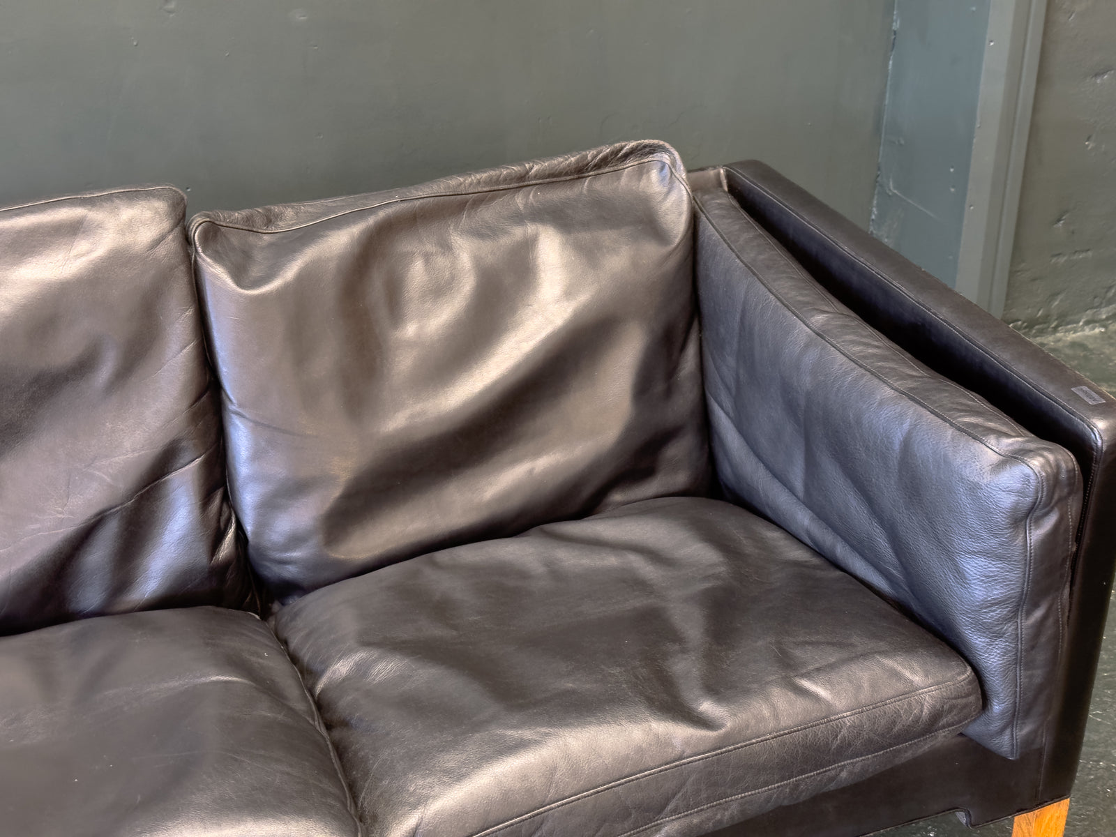 Black Leather Three-Seater Sofa