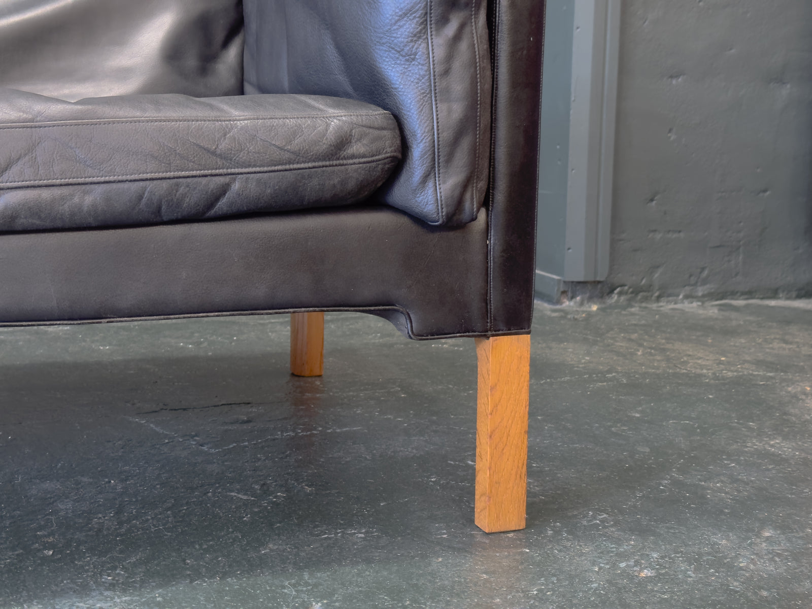 Black Leather Three-Seater Sofa