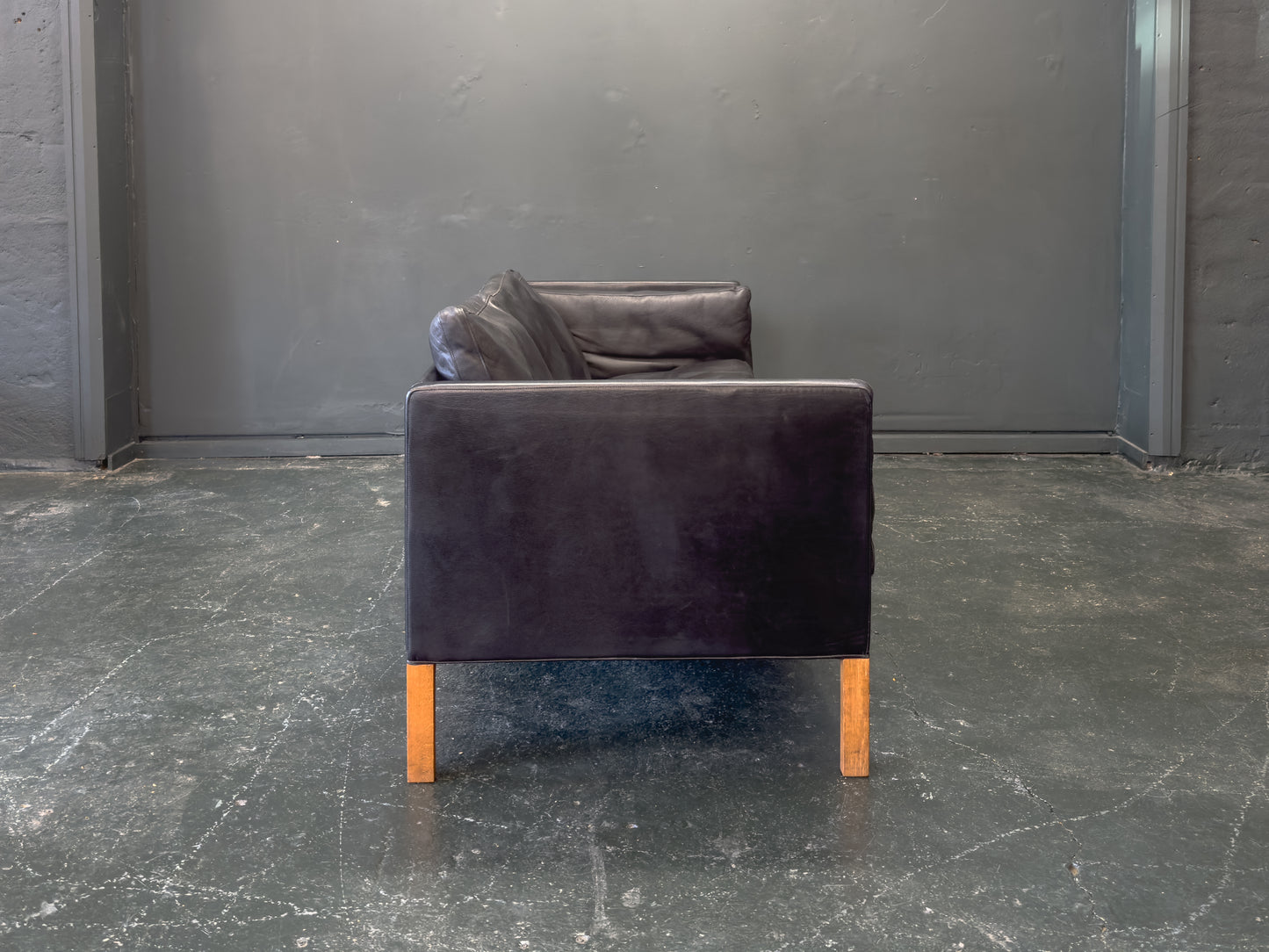 Black Leather Three-Seater Sofa