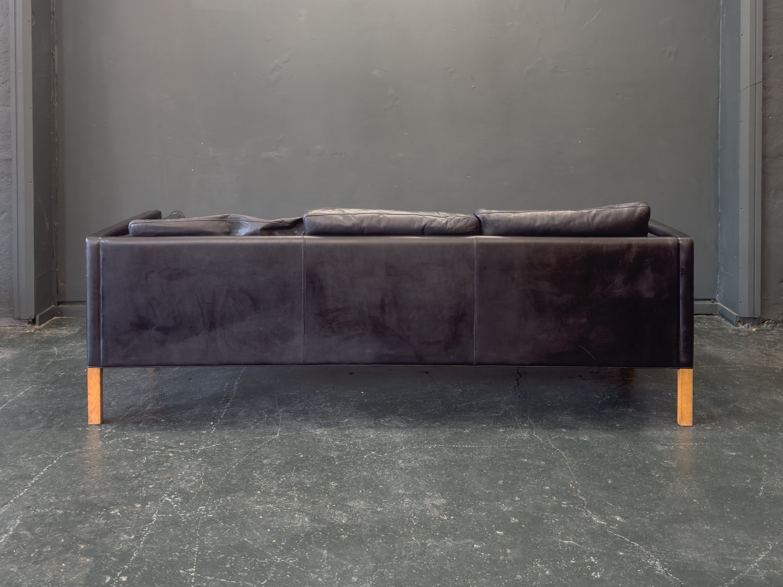 Black Leather Three-Seater Sofa