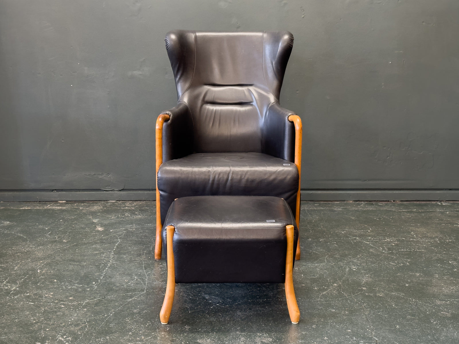'Claudia' Black Leather and Beech Highback Armchair with Footstool by Stouby
