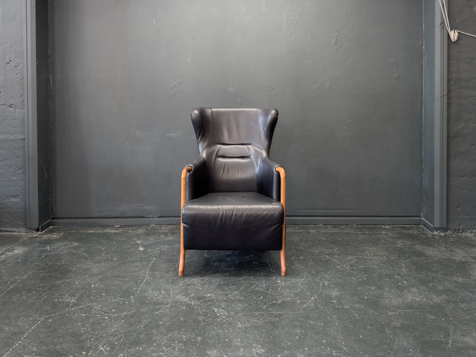 'Claudia' Black Leather and Beech Highback Armchair with Footstool by Stouby