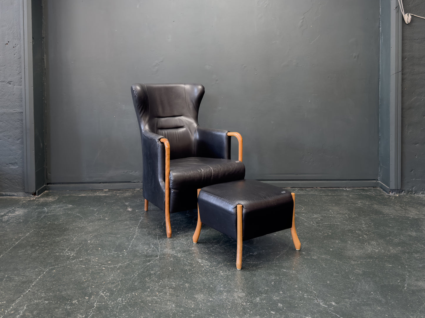 'Claudia' Black Leather and Beech Highback Armchair with Footstool by Stouby