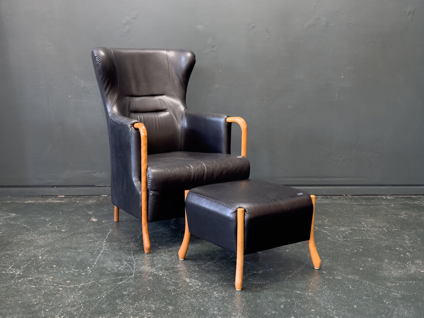 'Claudia' Black Leather and Beech Highback Armchair with Footstool by Stouby