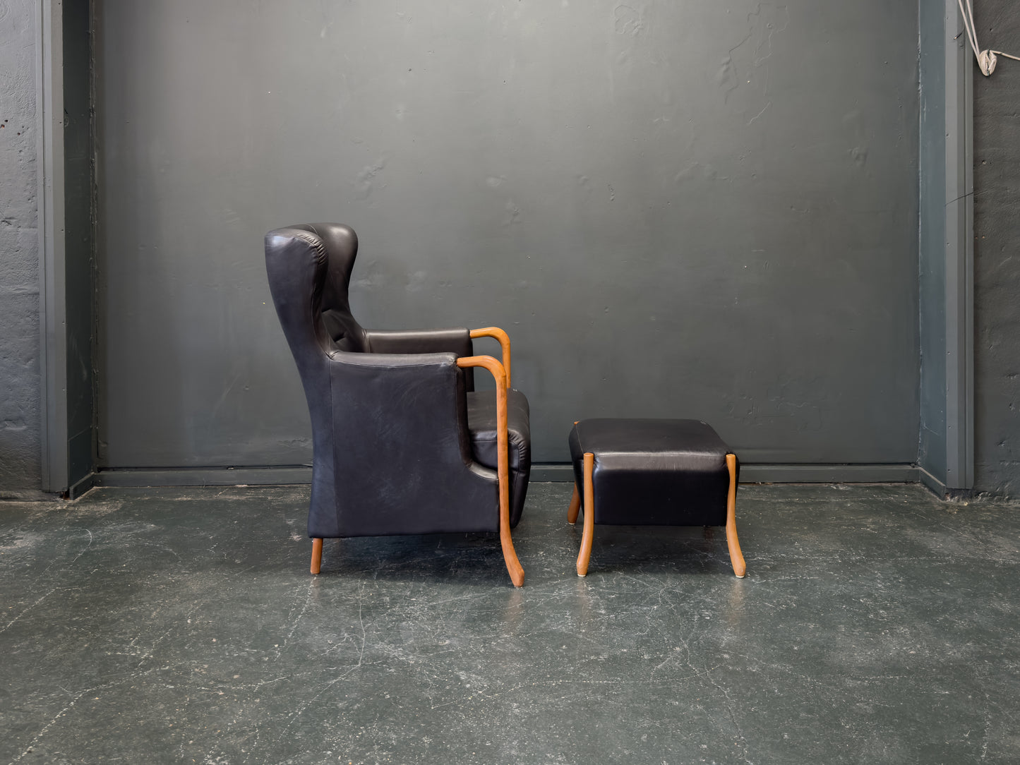 'Claudia' Black Leather and Beech Highback Armchair with Footstool by Stouby