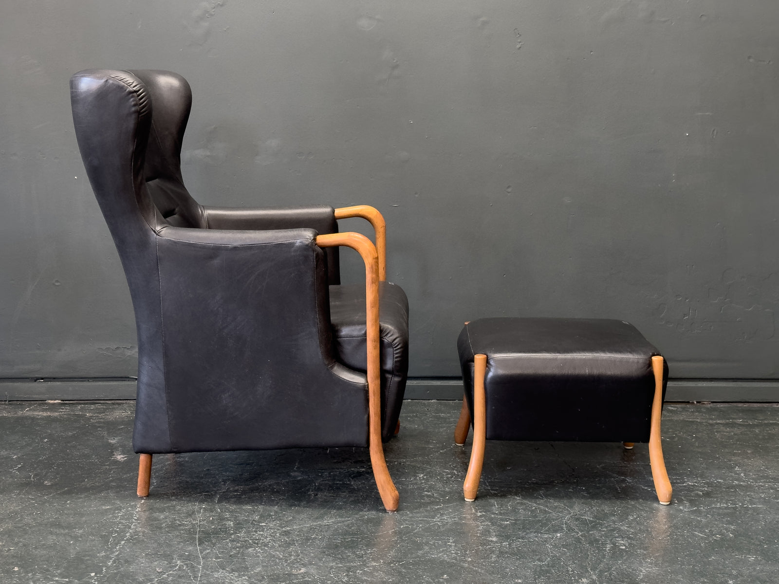 'Claudia' Black Leather and Beech Highback Armchair with Footstool by Stouby