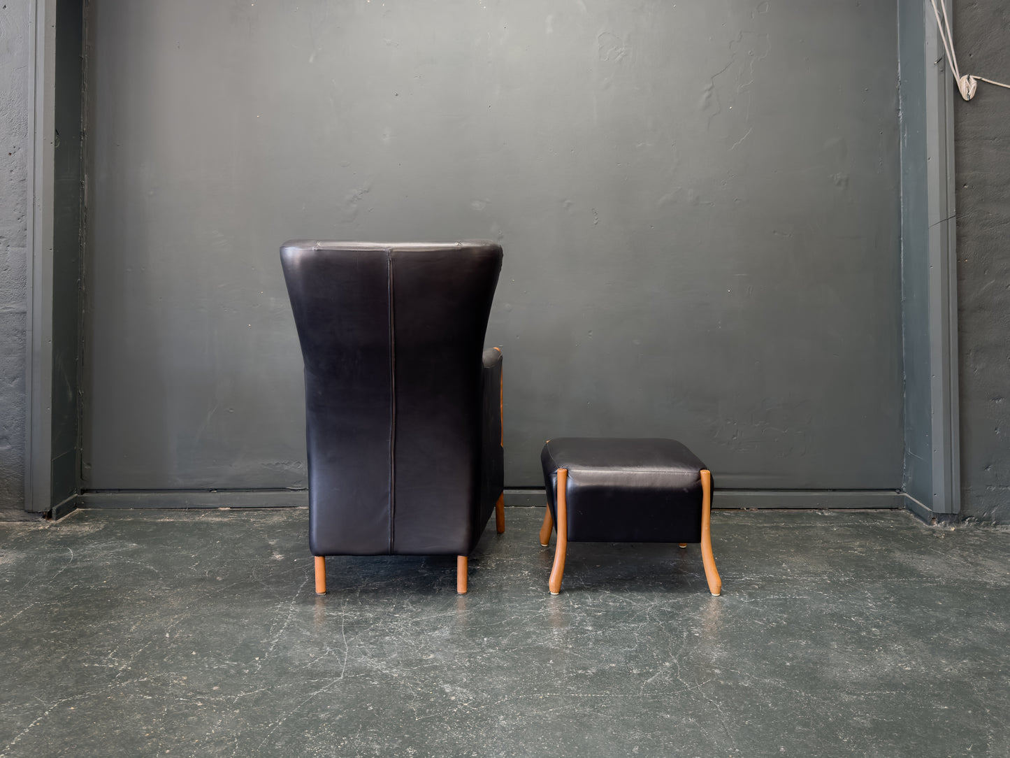 'Claudia' Black Leather and Beech Highback Armchair with Footstool by Stouby