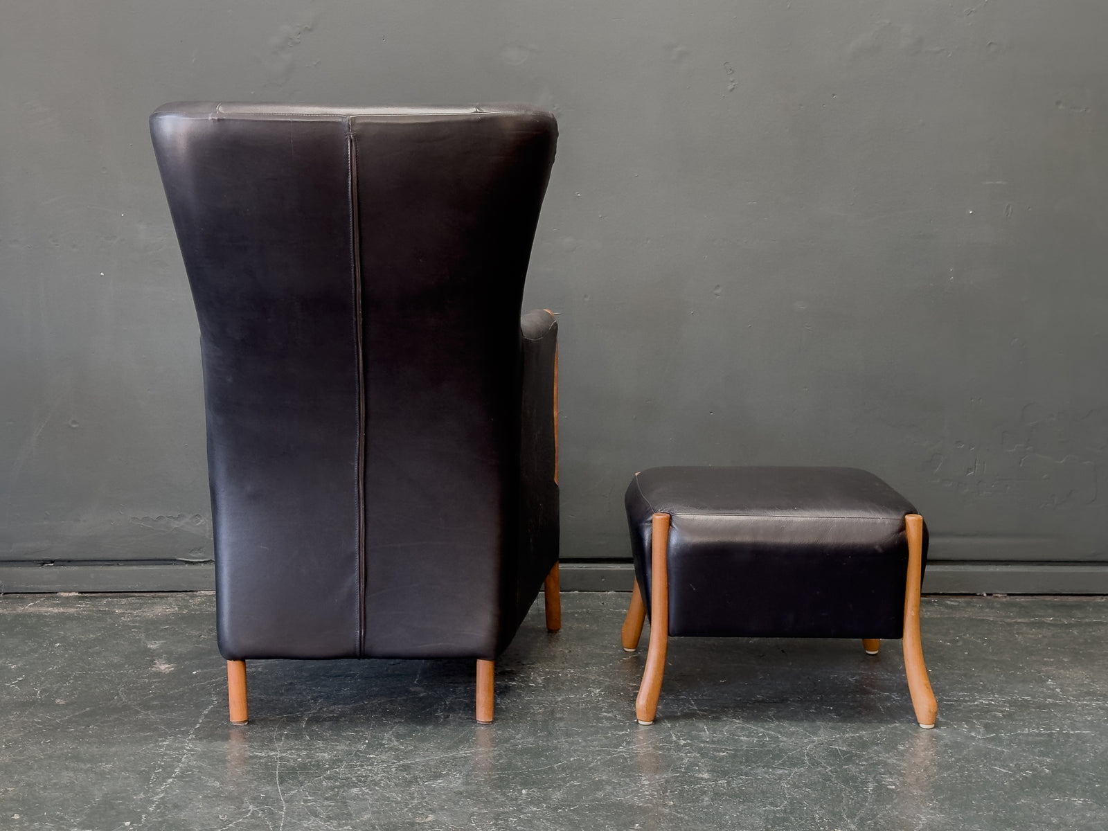 'Claudia' Black Leather and Beech Highback Armchair with Footstool by Stouby