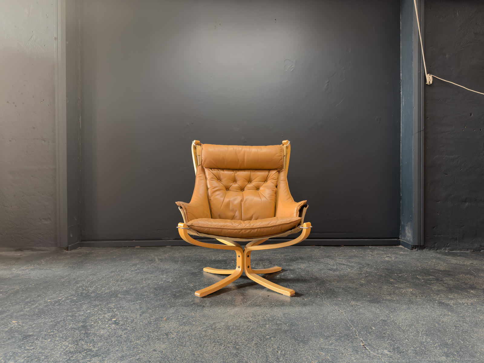 HIghback with Armrest Falcon Armchair by Sigurd Resell