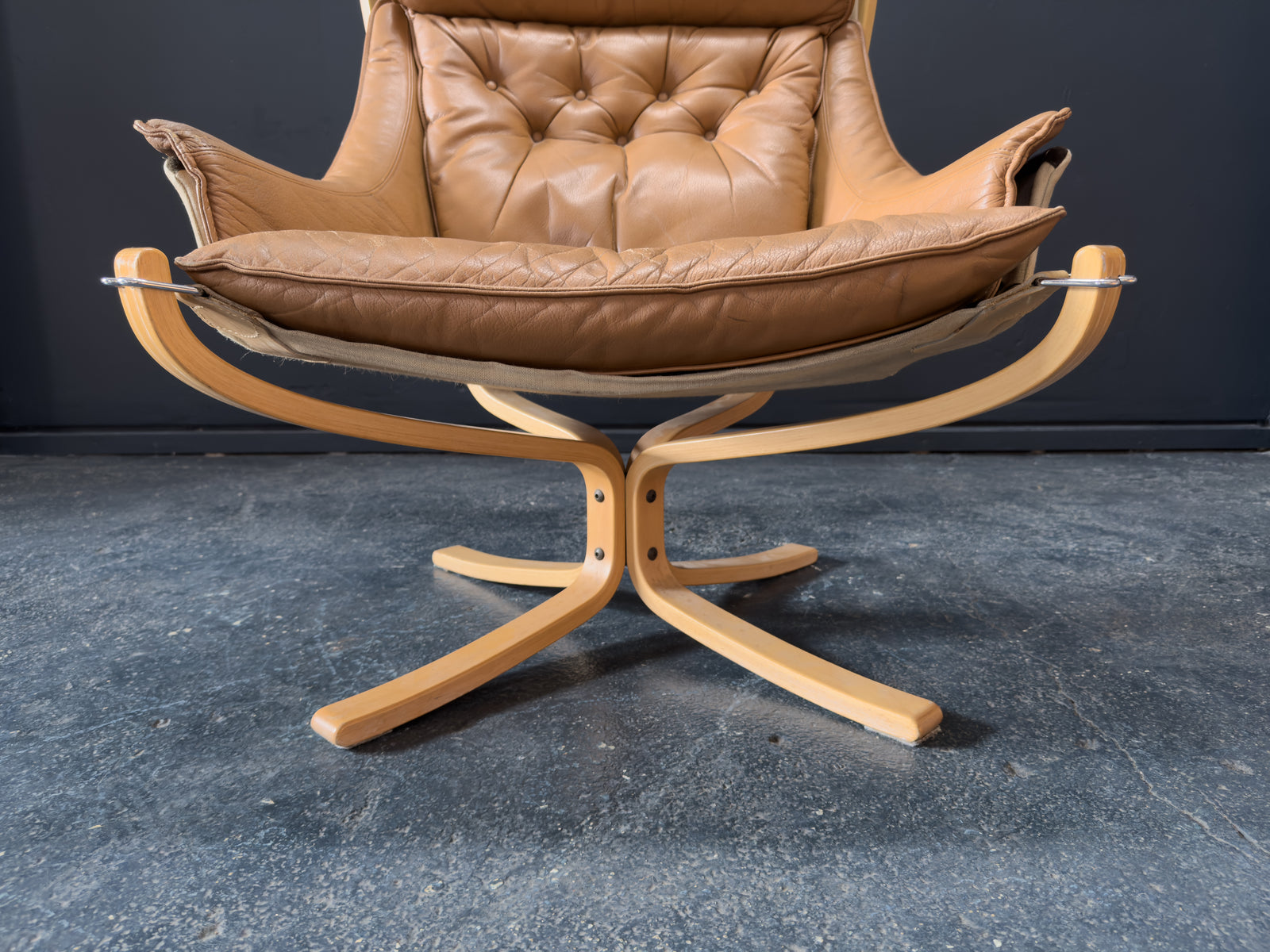 HIghback with Armrest Falcon Armchair by Sigurd Resell
