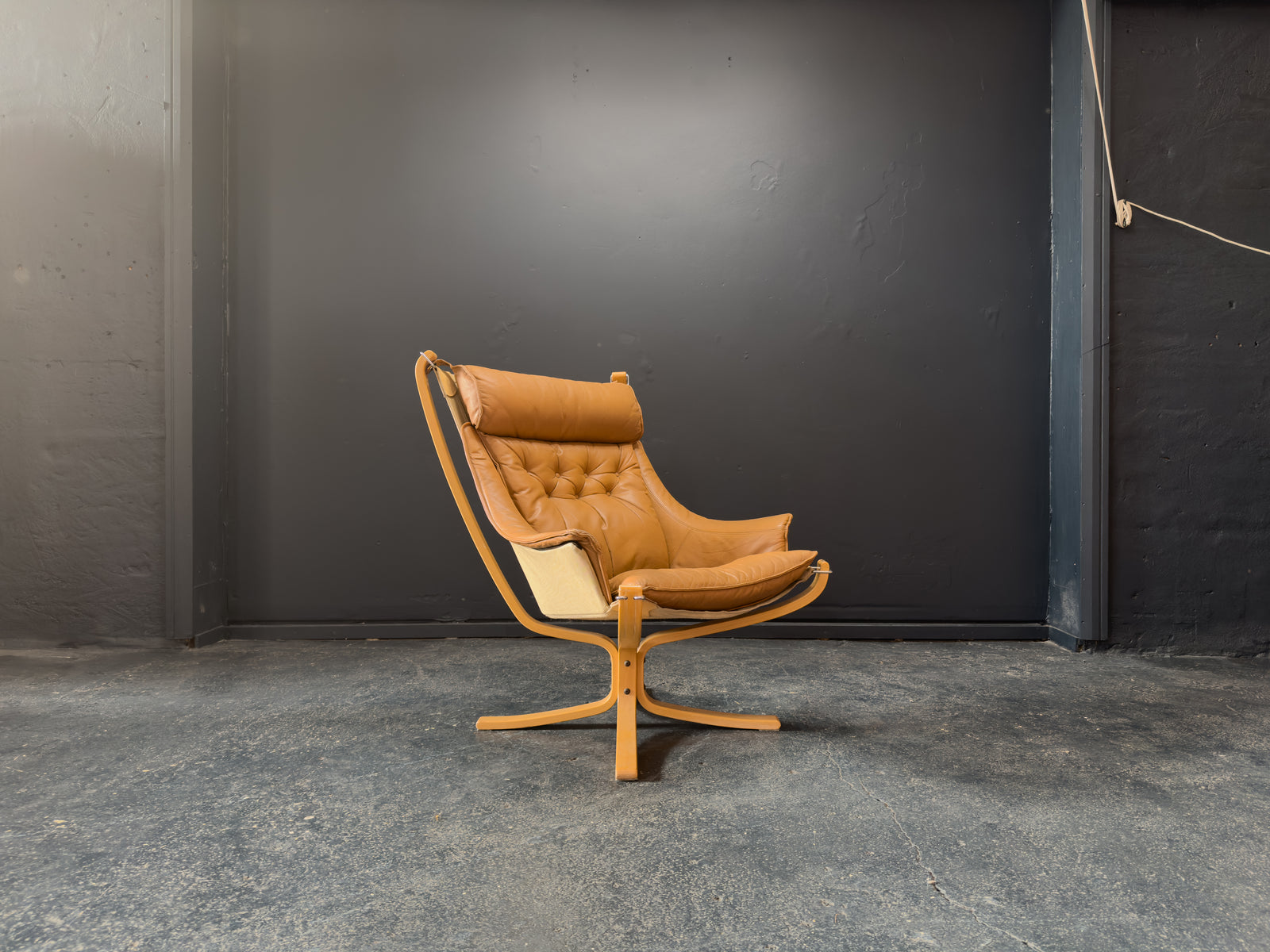 HIghback with Armrest Falcon Armchair by Sigurd Resell