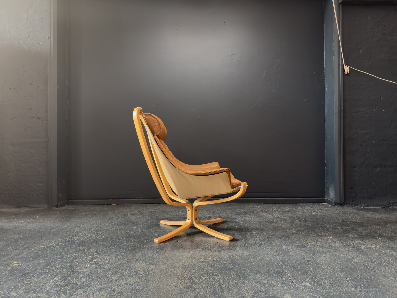 HIghback with Armrest Falcon Armchair by Sigurd Resell