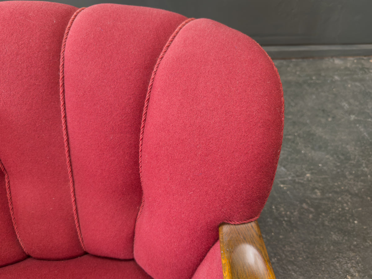 Red Upholstered Armchair with Scalloped Shape