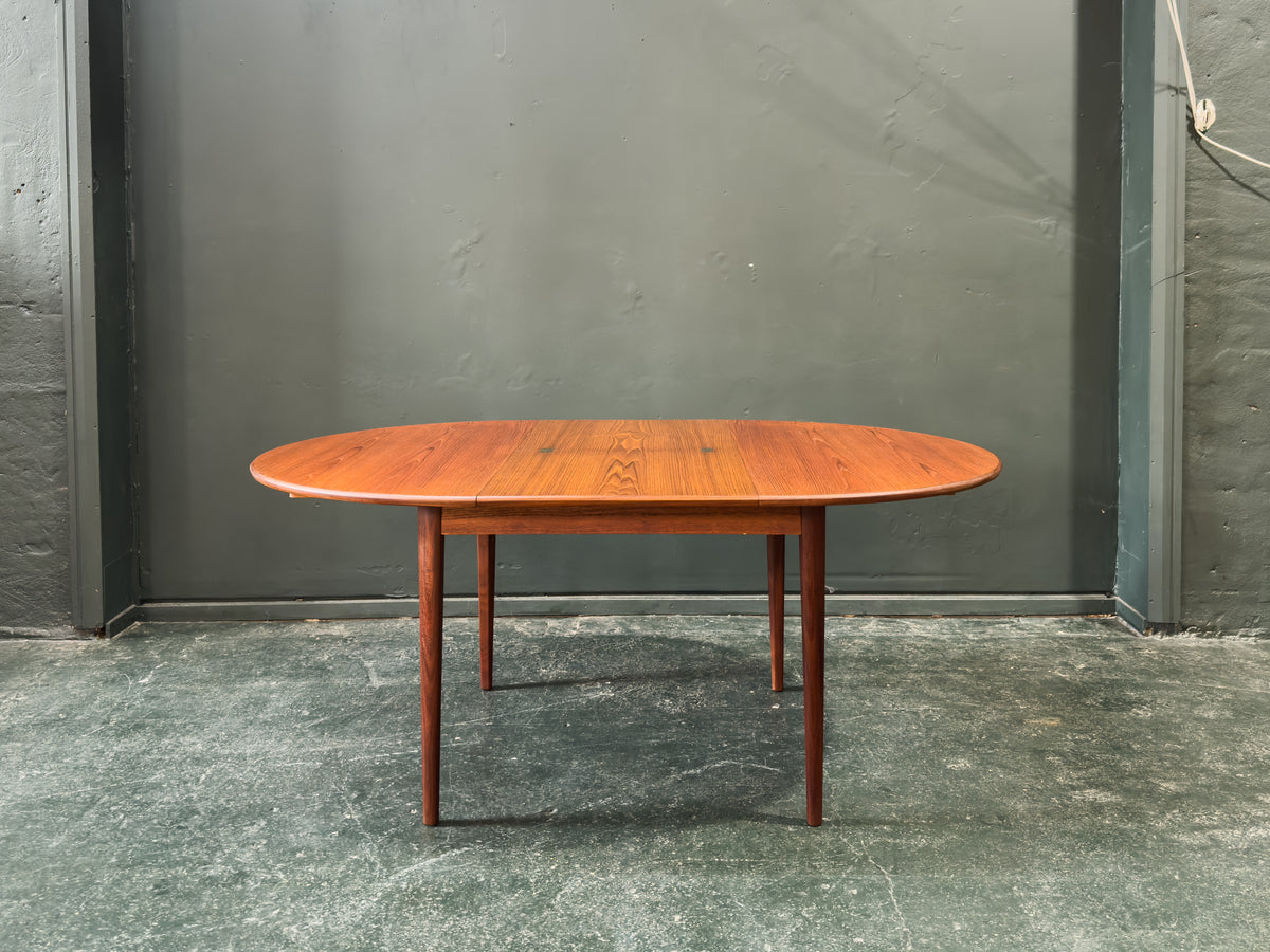 Round Teak Dining Table with Hinged Extending Leaf