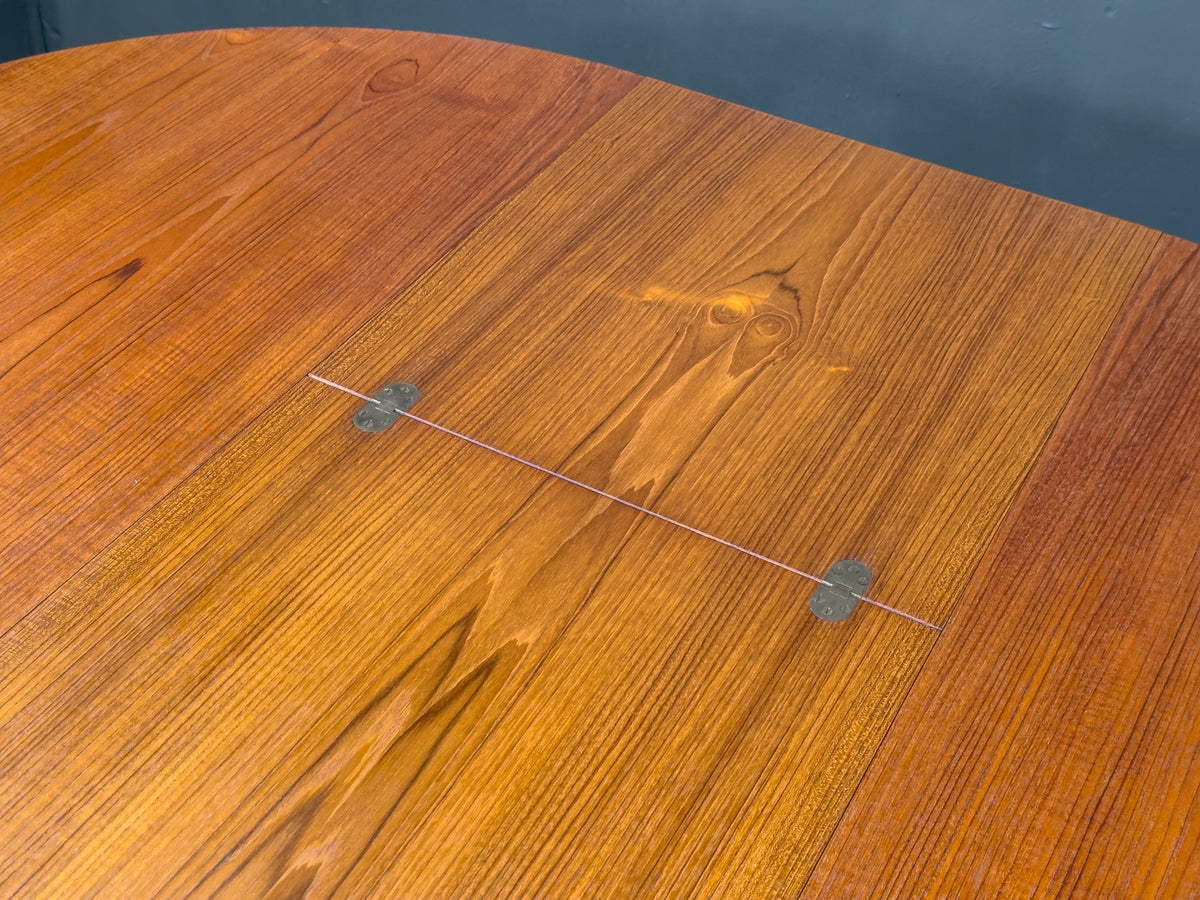 Round Teak Dining Table with Hinged Extending Leaf