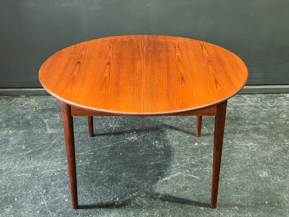 Round Teak Dining Table with Hinged Extending Leaf