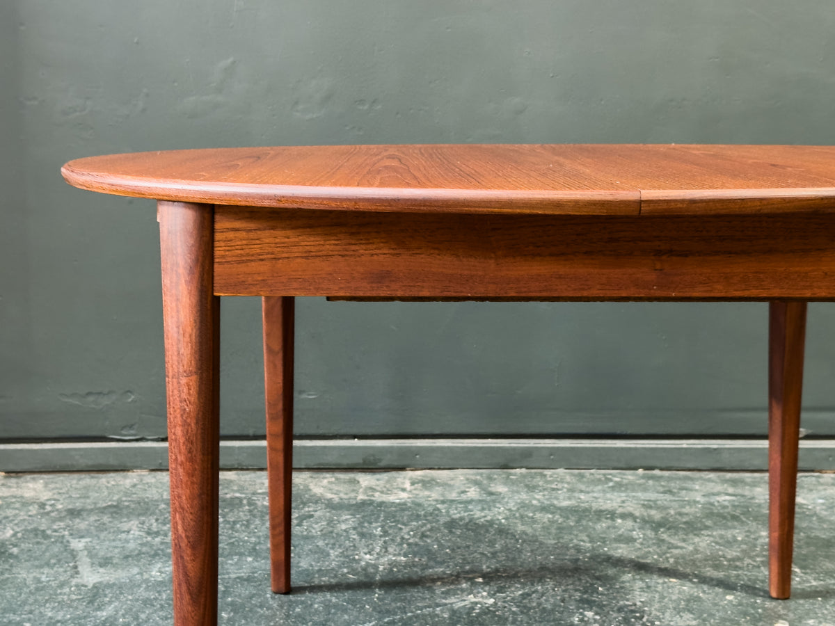 Round Teak Dining Table with Hinged Extending Leaf