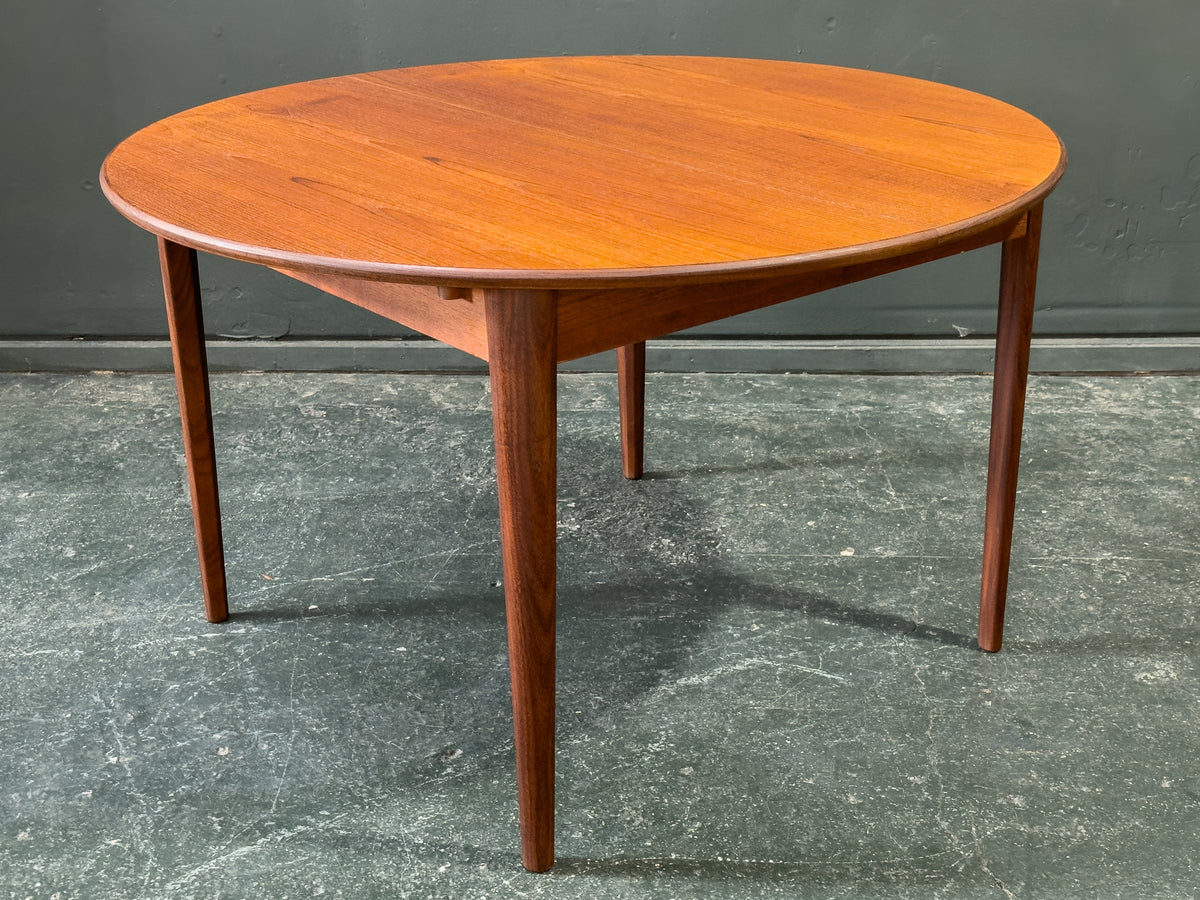 Round Teak Dining Table with Hinged Extending Leaf