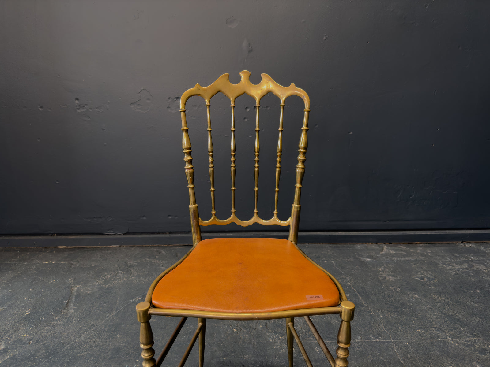 Brass and Tan Leather Chair