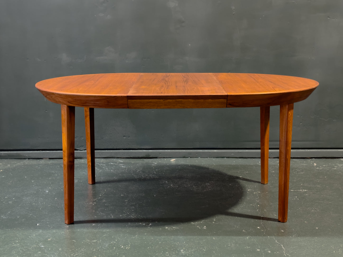 Extending round Teak Dining Table